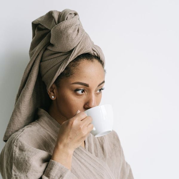 A cozy corner with a yoga mat, plant, and morning light, ready for a daily ritual.