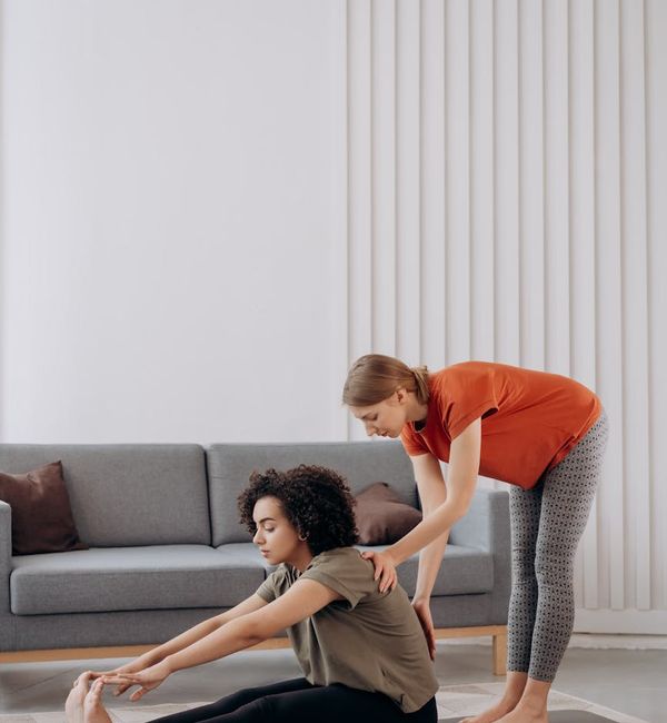 A woman performing a core-strengthening yoga pose with confidence.
